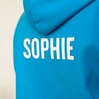 A ski trip hoodie with the student's individual name printed on the back