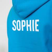 A ski trip hoodie with the student's individual name printed on the back