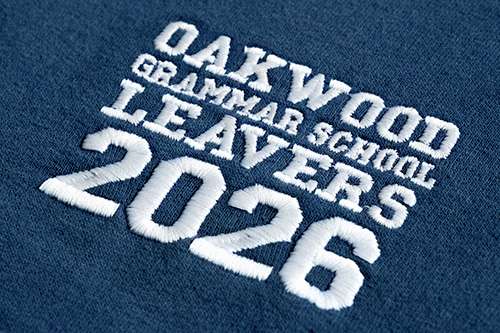 close-up photo of an embroidered school leavers hoodie design on the front left chest area