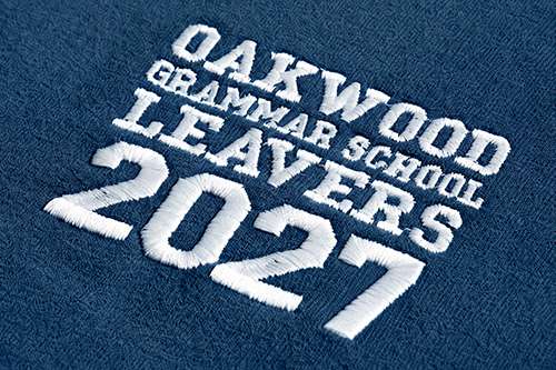 close-up photo of an embroidered school leavers hoodie design on the front left chest area
